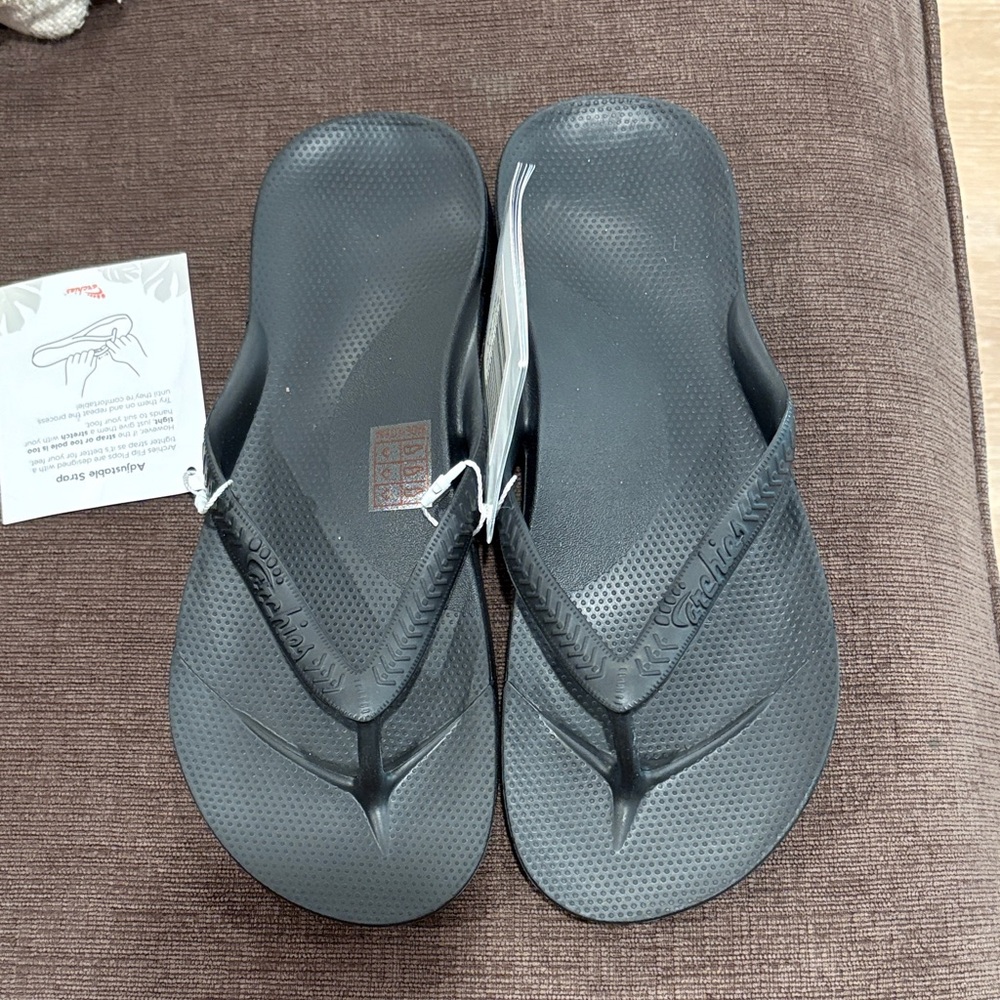 Archies black flip flops